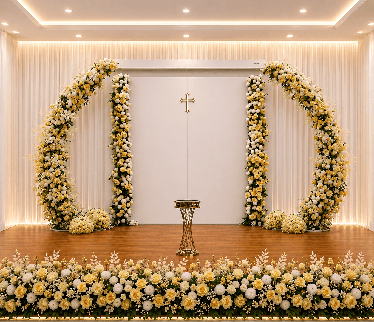 Holy Communion backdrop with a gold and cream floral arch and a cross, styled by Momentz Events